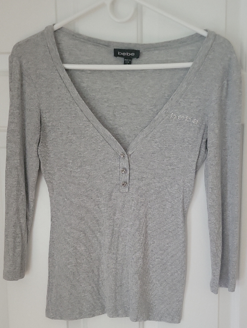 Bebe brand ribbed henley long sleeve shirt with rhinestone embellishment